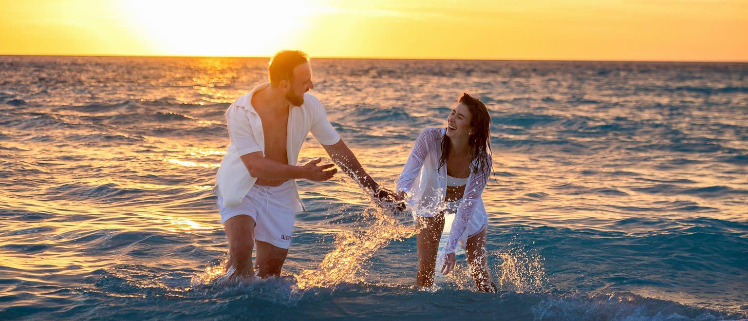 Couple at the beach during sunset