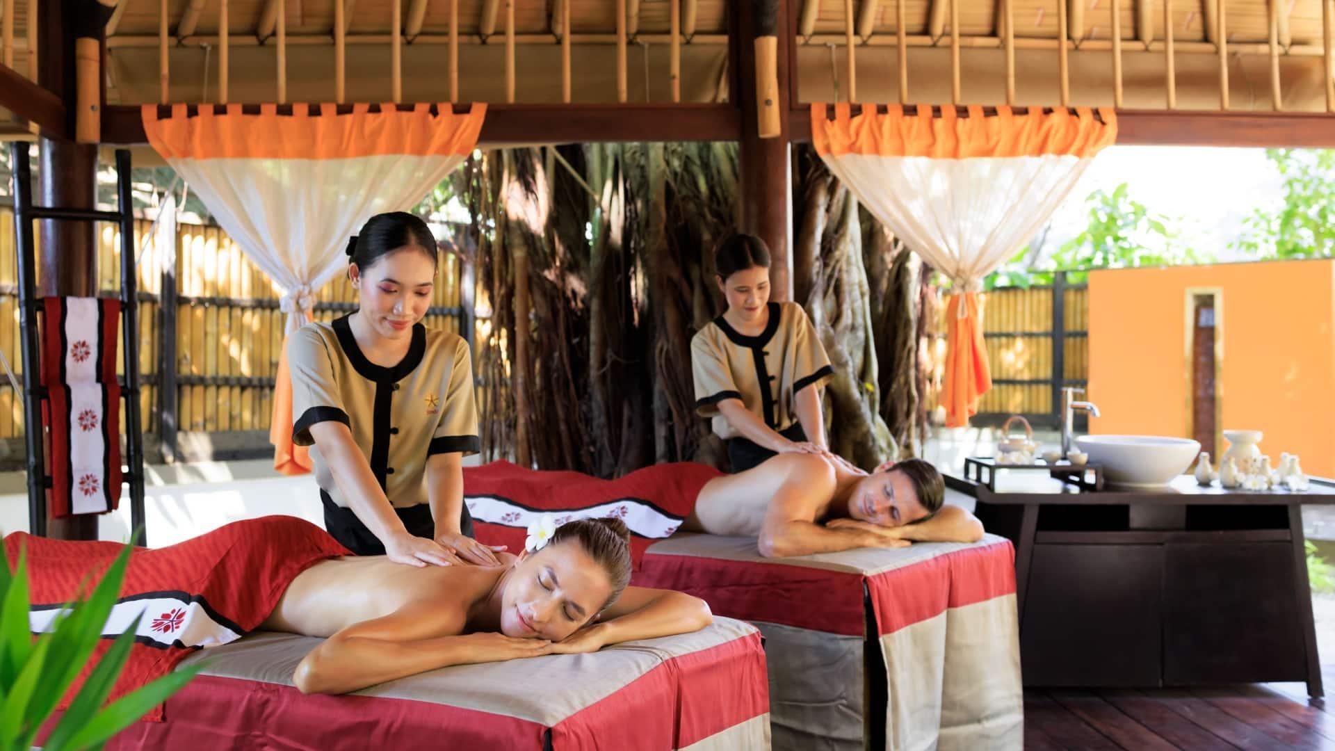 Two women enjoying massages at a spa